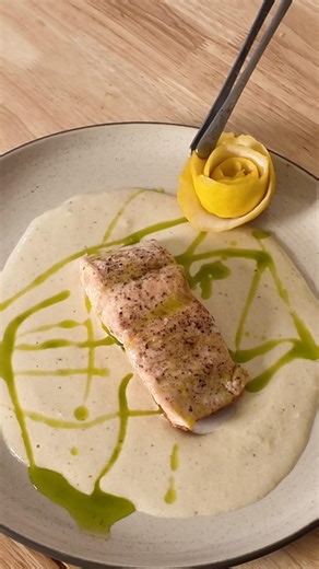Michelin star Salmon with cauliflower puree and herb oil