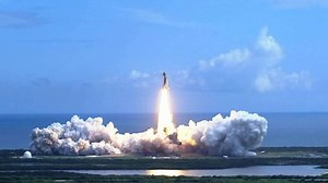 clip-1087996913-space-shuttle-lifting-off-over-water