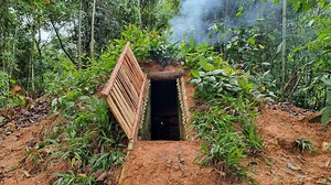 Building a hidden underground shelter, covered by grass and trees for a natural camouflage. A secure and secret refuge nestled in the wild. 🛠️🏕️ | The Forest Path