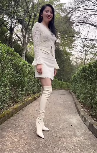 Fashionable Asian Girl in High Heels and Latex Boots