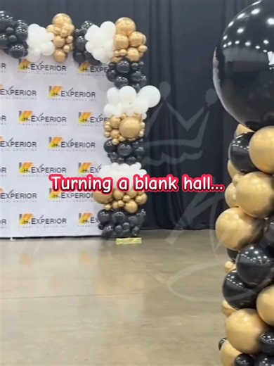 From empty exhibition hall → fully branded corporate event 🎈 Balloon Kings Dallas helped transform this blank space with a custom balloon garland backdrop and statement columns featuring logo toppers — turning a simple setup into a photo-ready brand moment. Perfect for conferences, trade shows, company celebrations, and brand activations across Dallas. 🚚 Delivery & installation across DFW 🏢 Corporate event décor specialists #DallasEvents #corporateevent #tradeshowdisplay #tradeshow #eventbran