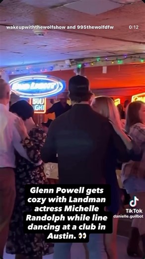 Glenn Powell gets cozy with Landman actress Michelle Randolph while line dancing at a club in Austin. 👀 - Tara and Ryan #WakeUpWithTheWolf (📸: @danielle.guilbot / tt) | Ryan Fox
