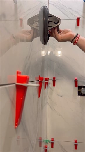 Installing 24x48 tile on shower walls. #remodel #construction #homerenovation #realestate #design #entrepreneur #interiordesign #renovation #homedecor #tools #diy #carpentry #work #asmr #designer #homemade #engineering #houserenovation #homemakeoveronabudget #diyrenovation | WINNI