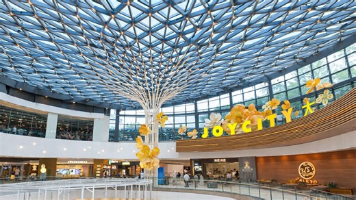 This China mall combines glass roof and tree-like centerpiece