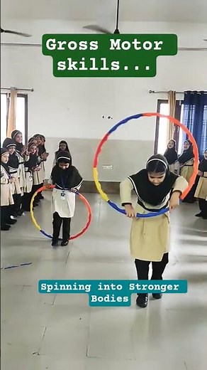 Hula Hoop Fun: Gross Motor Development with 1st Grade Girls #leapstart #kidscoach #peresources