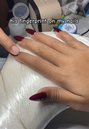 Stunning Red Nail Extensions with Fingerprint Designs