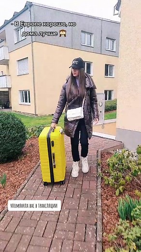 Struggling with a Heavy Yellow Suitcase Outdoors