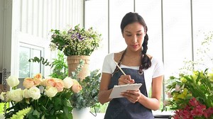 Young Asian woman entrepreneur/shop owner/ florist of a small flower shop business