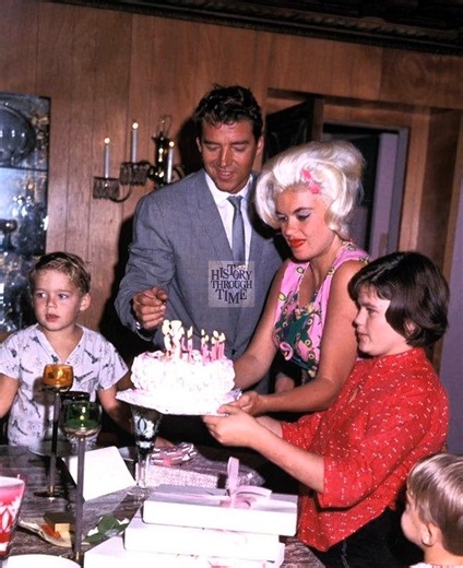 "Circa November 1963, Jayne Mansfield and her second husband, Mickey Hargitay, were photographed beaming with family pride during a private celebration at their opulent Beverly Hills estate, famously known as the Pink Palace." #fblifestyle | History Through Time