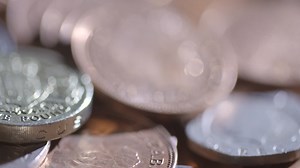 Free stock video - Tracking across harshly lit coins