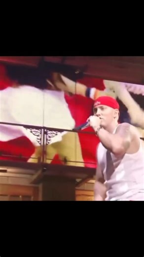 Scene Song on Instagram: "The clip shows a high-energy live performance of “Ass Like That” by Eminem, joined on stage by Bizarre. Performance Overview The footage captures the chaotic, comedic energy of Eminem’s mid-2000s concert era, with Bizarre adding to the wild stage presence that defined their shows at the time. The Artists Eminem appears in his signature mid-2000s look—white tank top, red bandana, and loose red-and-white pants—fully embodying his Encore-era persona. Bizarre stands beside 