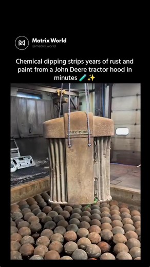 Matrix World on Instagram: "It looks like damage, but this is actually precision restoration at work 🛠️🧪 Instead of grinding or blasting, the John Deere tractor hood is submerged in a carefully controlled chemical bath that strips paint and rust at a molecular level. The solution reaches seams, edges, and hidden pores where corrosion builds over years, breaking chemical bonds without eating into the metal itself. When it’s done, only clean, solid steel remains—no warping, no thinning, just a p