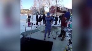 A Woman Prepares to Go Ice-Bathing, Slips on The Ice and Falls In