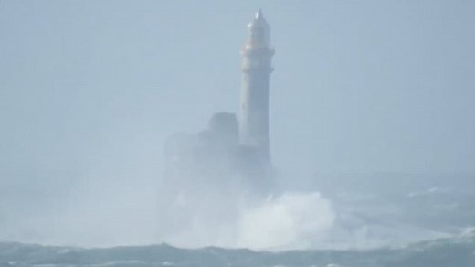 Lighthouse 'rocks back and forth' as waves crash into it