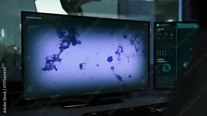 Studying the infection bacteria at the modern laboratory. Studying the infection bacteria movement under the microscope. Studying the infection bacteria cell for scientific research. Microbiology. UI.