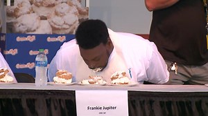 CBS 58's Frankie Jupiter participates in State Fair cream puff eating contest