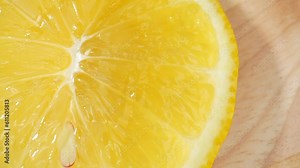 Captured in macro detail, the interior of a lemon showcases a maze of citrusy cells, creating a mesmerizing texture of translucent segments. Texture and surface background footage. 4K