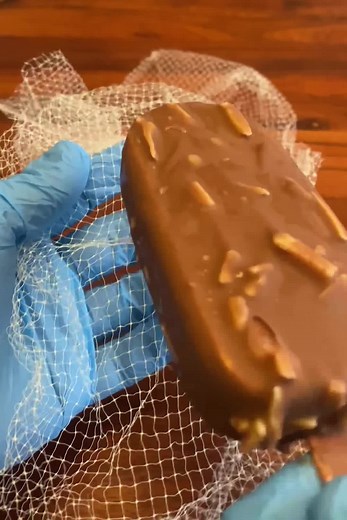 Chocolate Bar Manipulation with Blue Latex Gloves