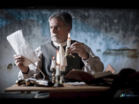 Quill pen writing, candle light, parchment paper (correspondence tools 18th century)