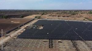 Rajkot, Gujarat, India 06 17 2024:aerial drone view showing large solar panels and large power stations