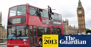 Illusionist Dynamo 'levitates' alongside bus - video
