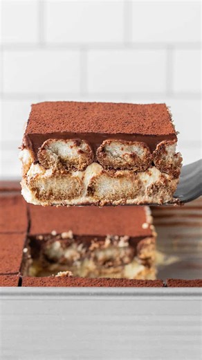 Nick Makrides on Instagram: "I bloody love a slice of cold tiramisu. My chocolate version is based on my mums. She uses chocolate pastry cream on top which is so silky and the biscuits are soaked in coffee with a delicious mascarpone cream bottom. It’s different, but trust me, it’s so worth trying! Comment ‘chocolate’ and I’ll DM you the recipe link! RECIPE: https://thescranline.com/chocolate-tiramisu/"