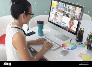 Caucasian female teacher using computer on video call with school children learning from home. Online education staying at home in self isolation duri Stock Photo - Alamy