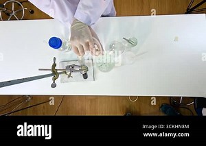 Scientist conducts copper carbonate decomposition experiment