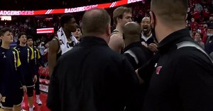 Michigan’s Juwan Howard hits Wisconsin assistant after a loss