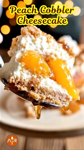 Peach Cobbler Cheesecake – Don’t Lose This Recipe Warm, creamy Holiday Southern comfort Where Classic Recipes Meet Modern Magic. This is the kind of dessert that belongs to Christmas afternoons and long Holiday evenings — when baked peaches bubble gently, cream cheese turns silky, and the kitchen smells like home. Peach cobbler meets cheesecake in one slow, generous slice, finished with honey warmth and a soft maple drizzle that feels like family gathered close. Don’t Lose This Recipe. | Astro R