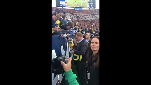 Roger Goodell signs autographs before Cowboys-Rams game