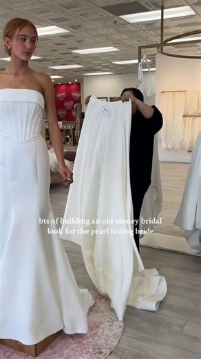 ✨ Help us build the ultimate old money bridal look! 🤍 Our senior stylist Triniti is showing how pearls transform a classic gown into an iconic moment. She starts with a clean strapless dress detachable overskirt, then layers in a pearl-scattered veil and headband for that timeless, pearl-loving vibe every elegant bride dreams of. 🎀 Which detail is your favorite finishing touch? #oldmoneybride #pearlbridalstyle #weddingdressshopping #bridetobe2025 #bridalinspiration #modernbride #arizonabride #