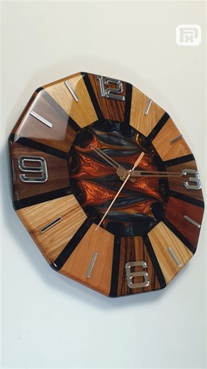 FxP art on Instagram: "Where Nature Meets Modern Design 🌿✨ Wooden & Epoxy Resin Wall Clock This clock is a perfect balance between nature and modern elegance. Crafted from several species of fine wood, it’s fused together with epoxy resin in deep copper and black tones. At the center lies a unique pattern created using my personal technique — impossible to replicate twice. The mirrored plexiglass numbers add a refined touch, catching and reflecting light beautifully. Each piece is one of a kind