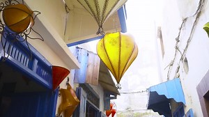 Free stock video - Yellow lantern hanging in alleyway