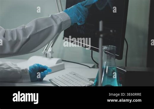 scientist in laboratory working with laptop and chemical test Stock Video Footage - Alamy