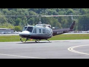 BELL 210 Helicopter full touch down Autos at KBFI Seattle