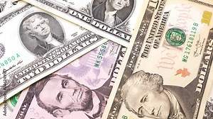 Banknotes in denominations of one to ten USA dollars. Rotation paper money close-up.