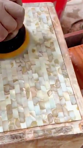 Using A Power Polisher To Add A High-Gloss Finish To A Beautifully Inlaid Wood Tabletop