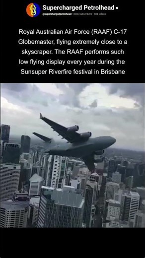 Australian C-17 globemaster flying between building