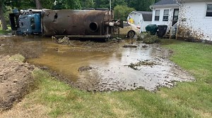 Manure truck crashes and drenches cars and homes with poop (video)