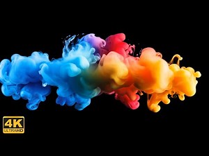 4K background Colorful rainbow paint drops from above mixing