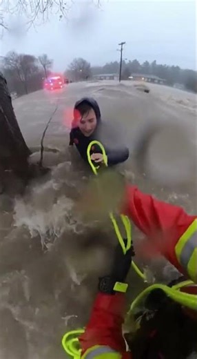 Firefighter Saves Life in Raging Flood Waters