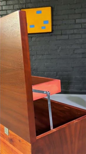 Lift the lid to find cedar storage and a suspended organizer tray, a detail that elevates the design