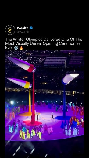 Wealth on Instagram: "This wasn’t an opening ceremony, it was large-scale visual engineering in motion. 🌍✨ At the Winter Olympics, the stadium was transformed into a living system of light, choreography, and suspended architecture, with massive floating installations pouring color from above while performers moved in perfectly synchronized circular patterns below. Every motion was precisely timed. Every color shift was intentional. The scale turned the arena itself into a dynamic canvas, where 