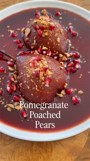 Gabrielle Chappel on Instagram: "Poaching pears is an aromatic wonderland. 🍐🍷 To a saucepan add: 1 cup red wine 1 cup pomegranate juice 1/2 cup sugar (add more to likeness) 4-5 cloves Peeled and cored pears Enough water to cover the pears Bring pears and liquid to a simmer and cook until tender (check with a fork) - remove and reduce liquid until it coats the back of a spoon and doesn’t run when you drag your finger through Garnish with toasted chopped almonds and pomegranate arils - add a sco