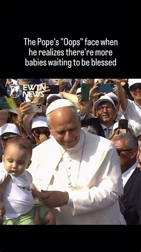 The Pope's "Oops" face when he realizes there's one more babies waiting to be blessed