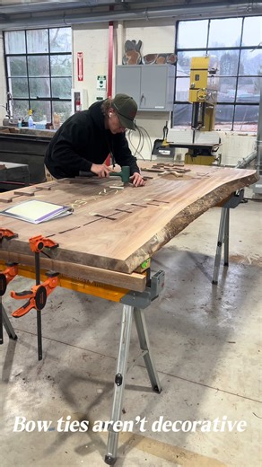Why do woodworkers add bow ties? They help stabilize cracks and preserve the integrity of the slab over time. This is craftsmanship doing its job. #WoodTok #WoodworkingProcess #LiveEdgeTable #Craftsmanship #FurnitureMaking