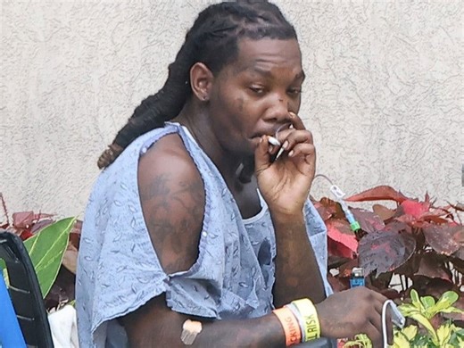 Offset seen for first time since being shot, smoking in hospital gown