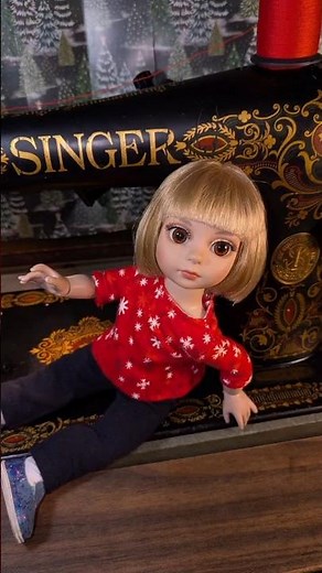 Dolly explores an antique Singer "Red Eye" sewing machine and notions