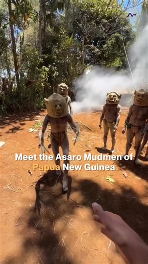 Across Wonders on Instagram: "High in the Eastern Highlands of Papua New Guinea lives the Asaro Mudmen, a tribe known for their ghostlike masks made of white clay and their bodies covered in mud. Their haunting look comes from a legend of survival and identity that has endured for generations. According to oral history, the Asaro people once escaped an enemy ambush by hiding in a riverbank. When they emerged coated in pale mud, the attackers believed they were spirits and fled in fear. The strat